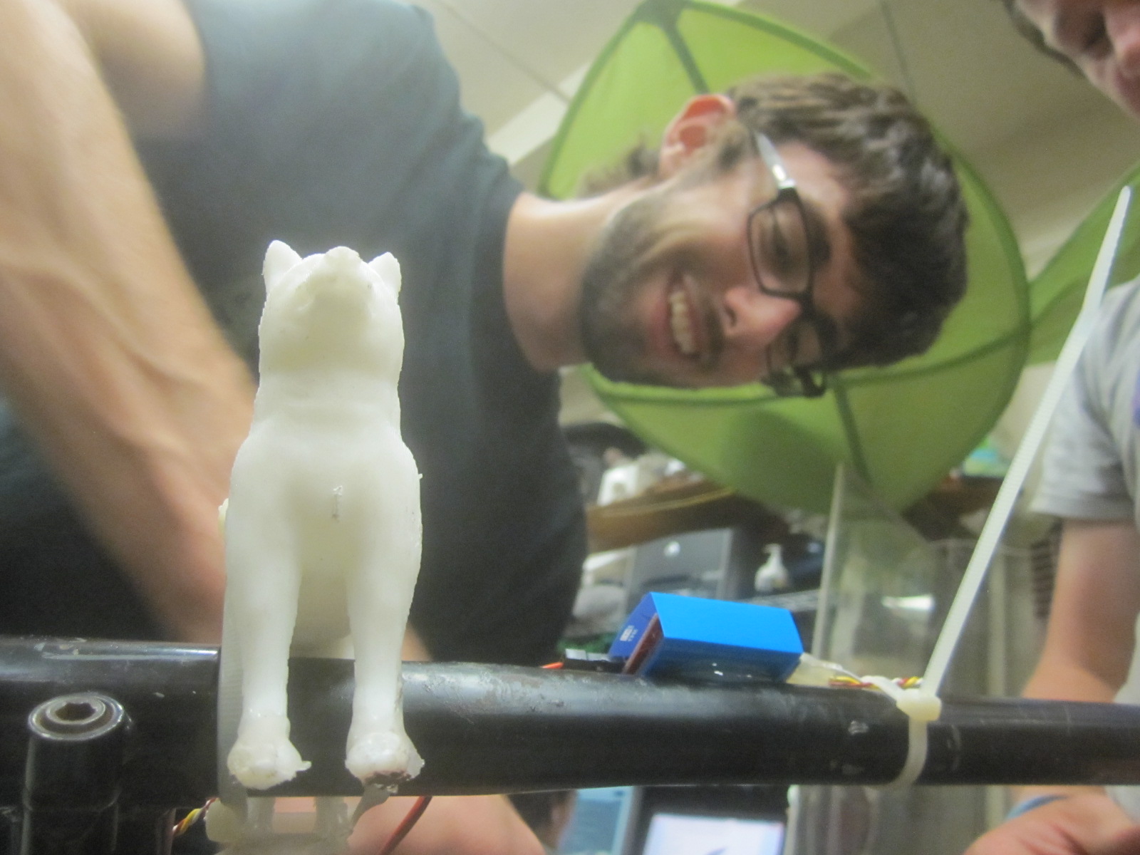 3D printed dog hood ornament with Mike in the background